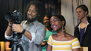 Jarrad Henderson shows students of the Urban Health Media Project how to frame video interviews during a demonstration in Washington, D.C., on October 2, 2018.