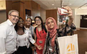 Graduates of Carnegie Mellon University’s AI4ALL summer program pose for a selfie with their instructor, Pat Virtue, during the end of program celebration.