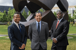 Ainsley Thomas, Hudson Valley Community College’s (HVCC) chief diversity officer, and President Roger A. Ramsammy meet with Mac-Arthur Louis, IT manager at Health Research Inc., as he introduces students to information technology through the HVCC STEM Outreach Workshop Initiative