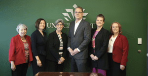 Interdisciplinary by design, UNC Charlotte’s School of Data Science is led by Executive Director Doug Hague, center, with input from the deans of represented colleges: Nancy Gutierrez, College of Liberal Arts and Sciences; Fatma Mili, College of Computing and Informatics; Provost Joan Lorden; Catrine Tudor-Locke, College of Health and Human Services; and Jennifer Troyer, Belk College of Business.