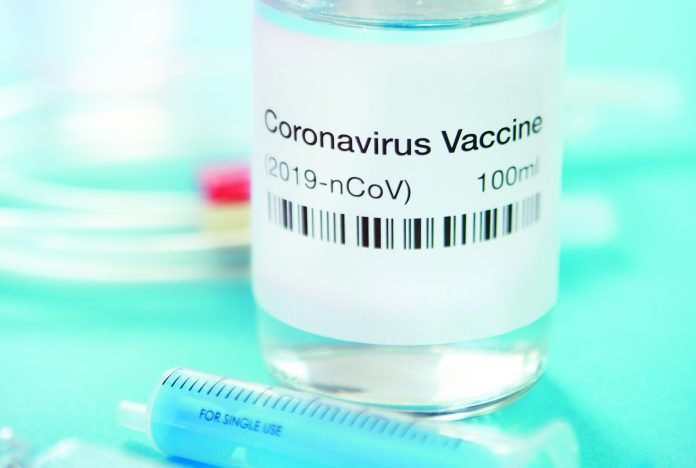 Coronavirus vaccine Photo of a vial that contains a label reading Coronavirus Vaccine