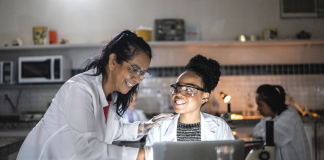 two women talking in a science lab