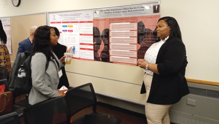 FFOC 1 Two graduate students talk at the Preparing Future Faculty of Color Conference.
