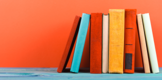 Several books stacked in a row