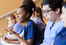 Diverse medical school students having a discussion in class